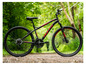 Ein schwarzes Mountainbike von Huffy mit roten Details.