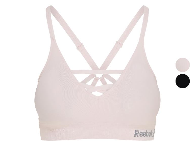 Hellrosa Sport-BH mit gekreuzten Rückenträgern und einem dezent strukturierten Band