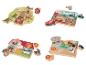 Vier Holzpuzzles mit verschiedenen Themen: Wald, Transport, Bauernhof und Dschungel.