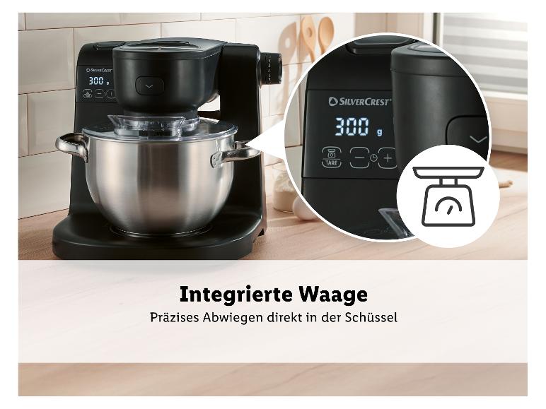 Schwarze Küchenmaschine mit integrierter Waage, die 300g anzeigt, 'Integrierte Waage'.