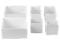 Set weißer Textil-Aufbewahrungsboxen in verschiedenen Größen.