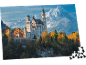 Puzzle mit dem Motiv von Schloss Neuschwanstein im Herbst mit Bergen im Hintergrund.