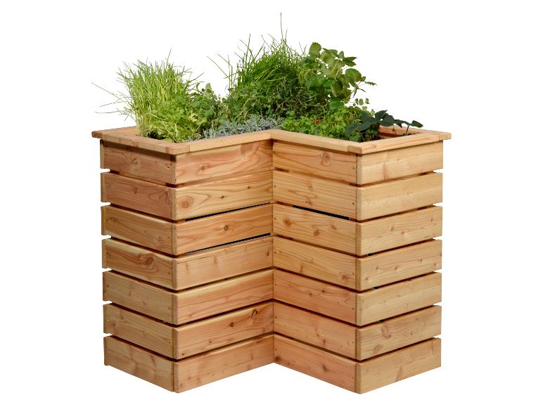 L-förmiges Hochbeet aus Holz mit verschiedenen Kräutern und Pflanzen