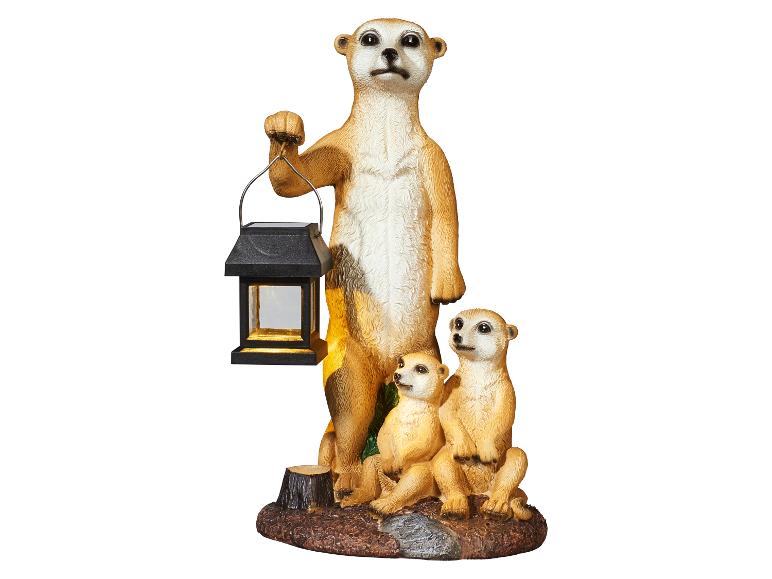 Dekorative Figur einer Erdmännchenfamilie, wobei das erwachsene Tier eine Solarlaterne hält.