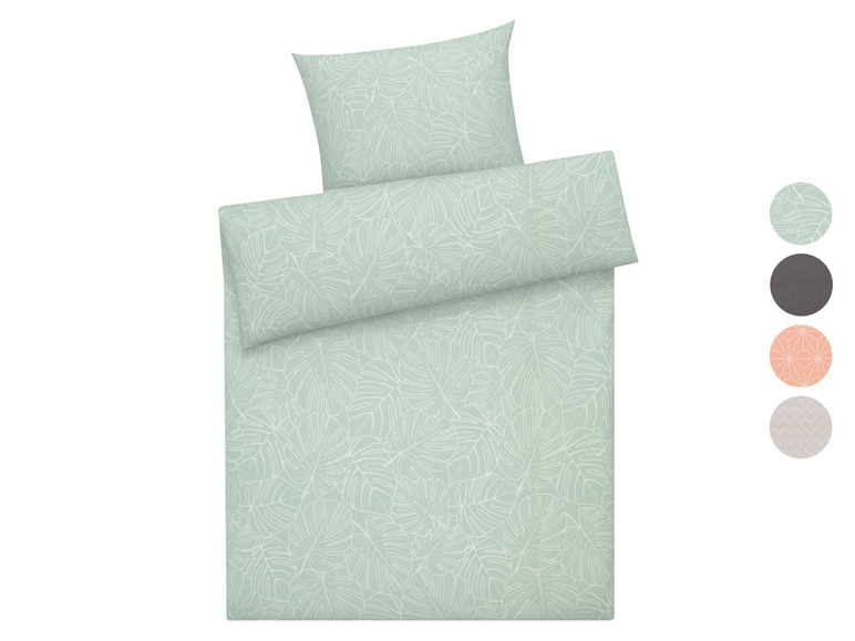 Bettwäsche mit tropischem Blättermuster.