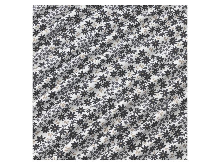 Weißer Stoff mit einem schwarzen Blumenmuster.
