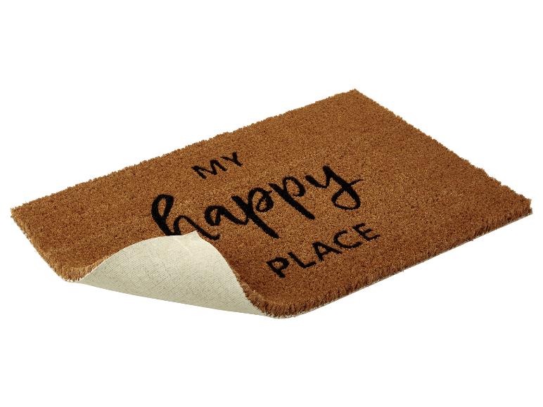Eine braune Fußmatte mit dem Text 'My happy place'.