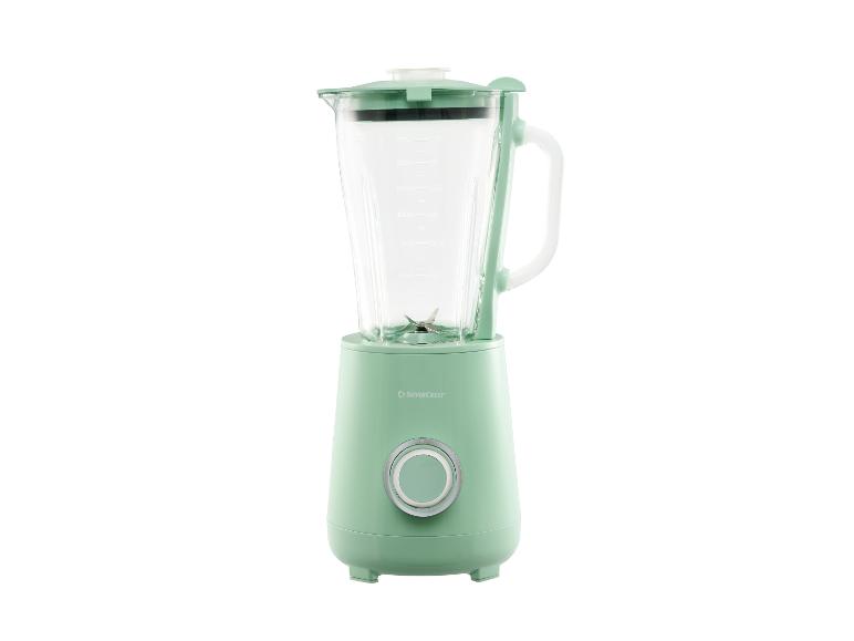 Hellgrüner Mixer mit Glaskrug und silbernem Drehknopf.