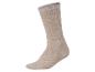 Einzelne beige Socke mit gerippter Textur und verstärkter Ferse und Spitze.