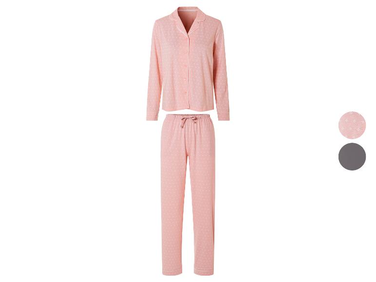 Ein rosa Schlafanzug mit langen Ärmeln und einem weißen Muster.