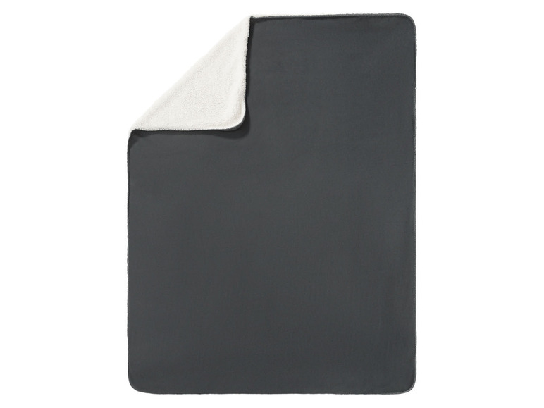 Eine dunkelgraue Fleece-Decke mit weißem Teddyfutter.