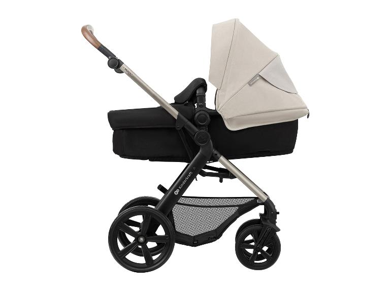 Seitenansicht eines beigen und schwarzen Kinderwagens mit braunem Griff.