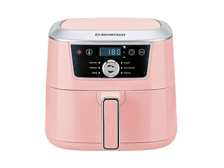 Rosa Heißluftfritteuse mit Digitalanzeige, die 180 Grad Celsius und verschiedene Kochmodi anzeigt.