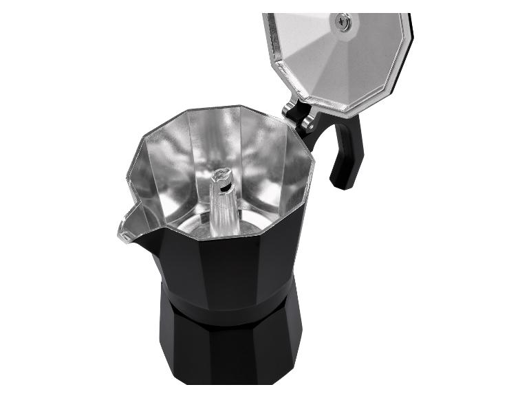 Offene schwarze Mokkakanne mit silbernem Innenleben und Griff.