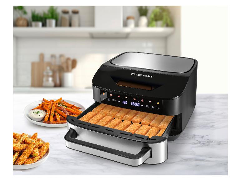 Heißluftfritteuse mit Fischstäbchen, Süßkartoffelpommes und Zucchini-Sticks.