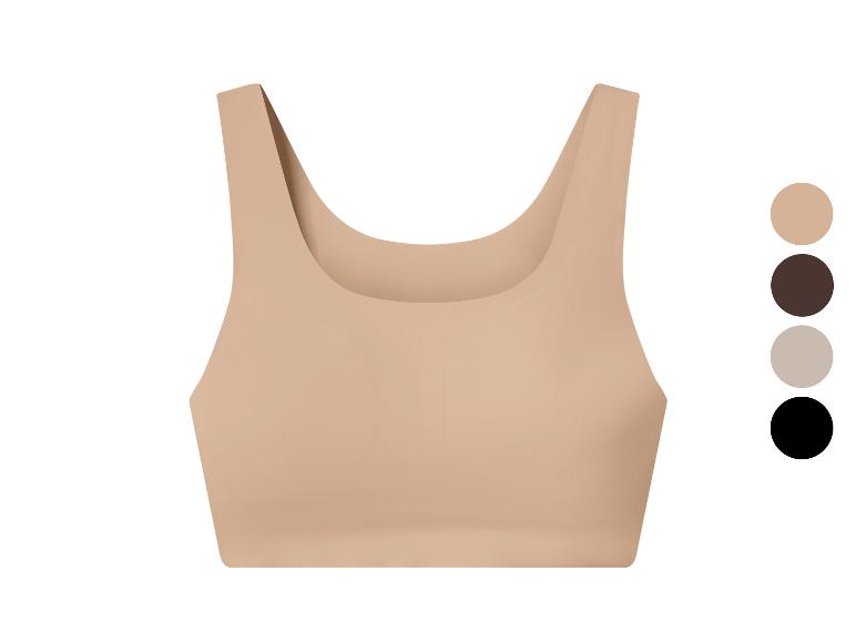 Hautfarbenes Sport-Top mit Farbpalette: Beige, Braun, Grau und Schwarz.