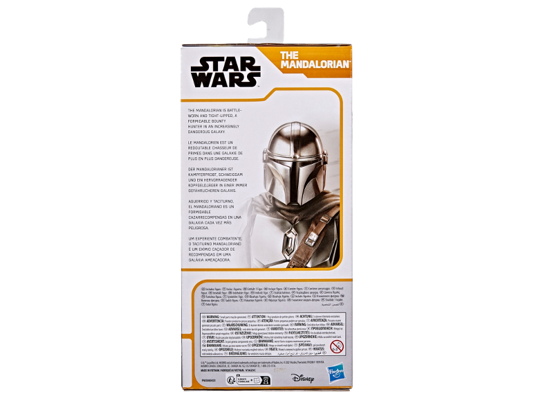 Rückseite einer Spielzeugverpackung mit einer Figur mit Helm und mehrsprachigen Beschreibungen.