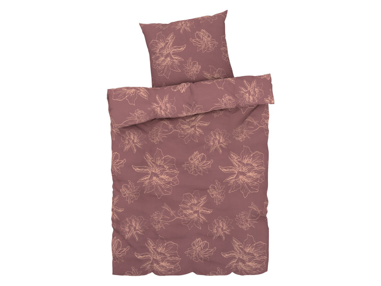 Ein rosafarbenes Bettbezug-Set mit Blumenmuster.
