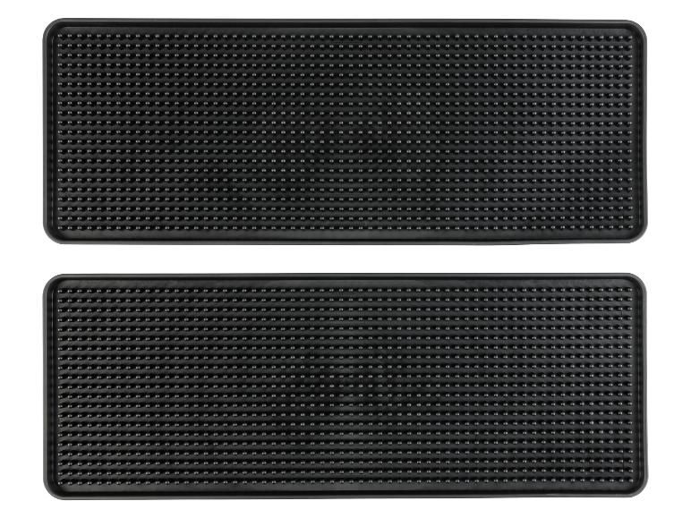 Zwei schwarze Gummimatten mit Noppen.