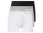 Drei Paar Boxershorts in weiß, grau und schwarz.