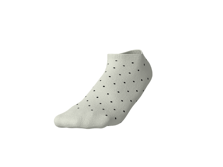 Weißer Socken mit schwarzen Punkten.