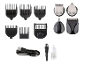 Haarschneidemaschinen-Zubehör, inklusive Aufsteckkämmen, Ersatzköpfen, USB-Kabel, Bürste und Öl.