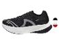 Schwarze Sportschuhe mit weißer Sohle und grauen Details.