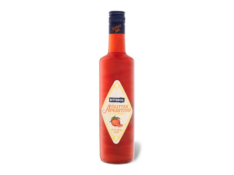 Rote Aperitifflasche mit der Aufschrift 'Shake Me' und einem 'Glitter Aperitivo' Etikett.