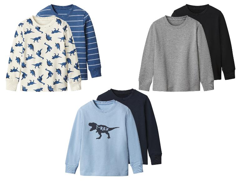 Set aus sechs langärmligen Kinder-Shirts in verschiedenen Farben und Dinosaurier-Prints.