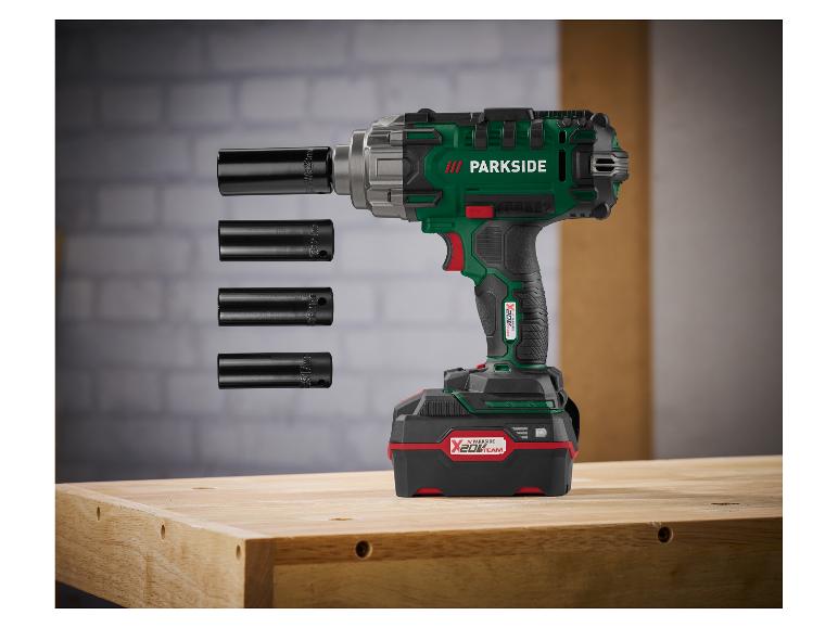 Grüner und schwarzer Parkside Schlagschrauber mit Akku und vier Nüssen.