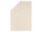 Gefaltete beige Fleecedecke