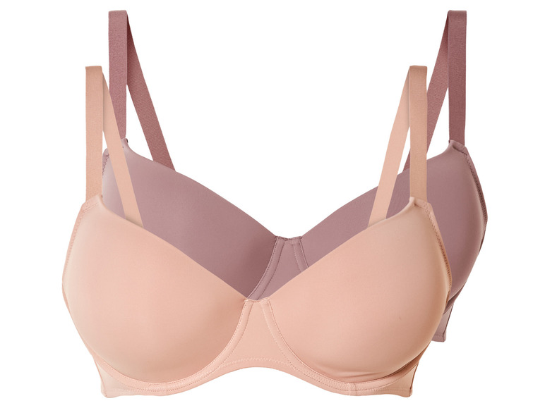 Zwei beige BHs mit breiten Trägern.