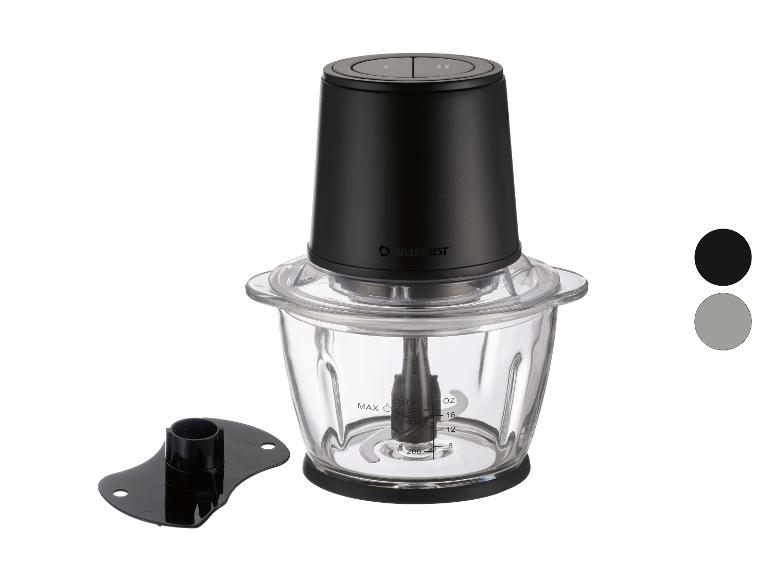 Schwarzer Zerkleinerer mit Glasschüssel und zusätzlichem Aufsatz, auf weißem Hintergrund.