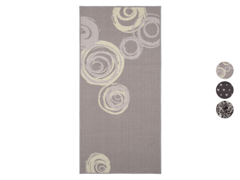 Graue Fußmatte mit einem Muster aus weißen Kreisen.