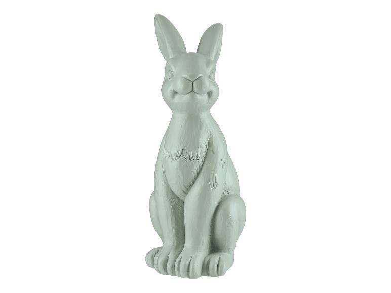 Eine graue Kaninchenfigur.