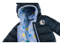 Dunkelblaue Steppjacke mit hellblauem Futter und Cartoon-Mauskopfmustern.