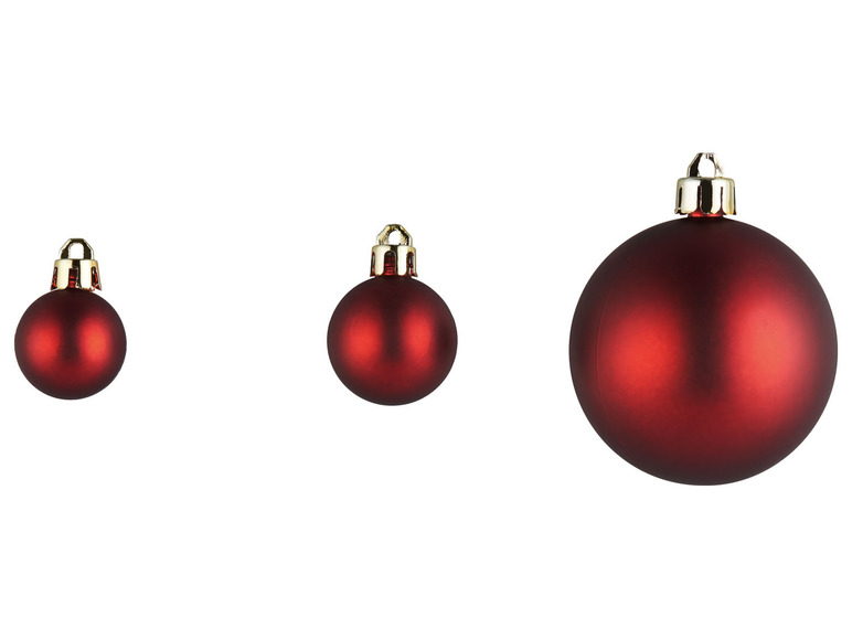 Drei rote Weihnachtskugeln in verschiedenen Größen.