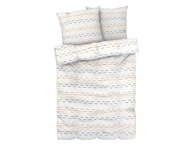 Betwäsche und Kissenbezüge mit blauen und beigen Streifen.