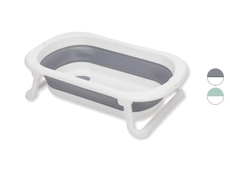 Faltbare Babybadewanne, weiß und grau, mit Stützfüßen.