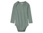 Ein graues Upilu Baby-Body mit langen Ärmeln.