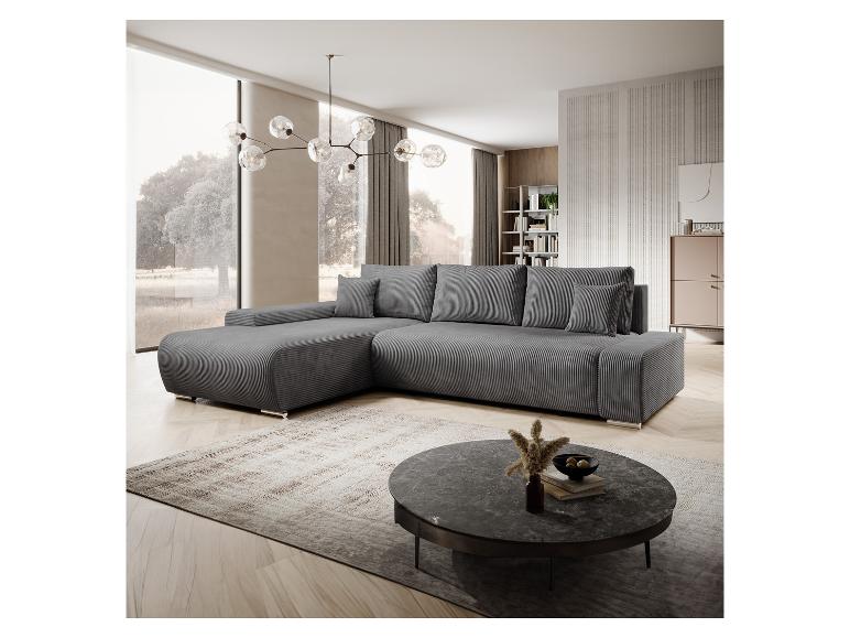 Graue Eckcouch aus Cord und moderner Couchtisch.