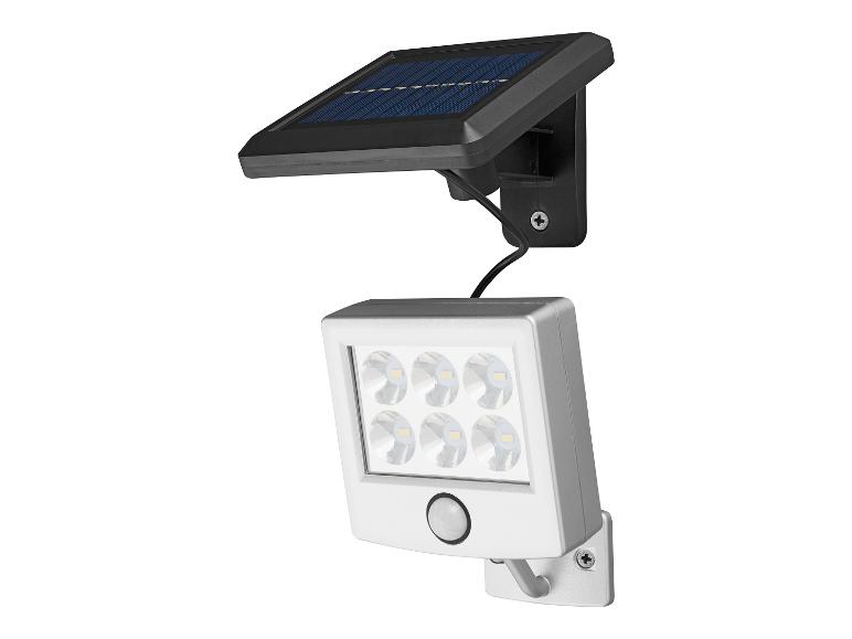 Eine weiße LED-Lampe mit Bewegungssensor und Solarpanel.