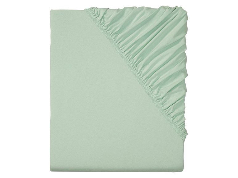 Ein mintgrünes Spannbettlaken.