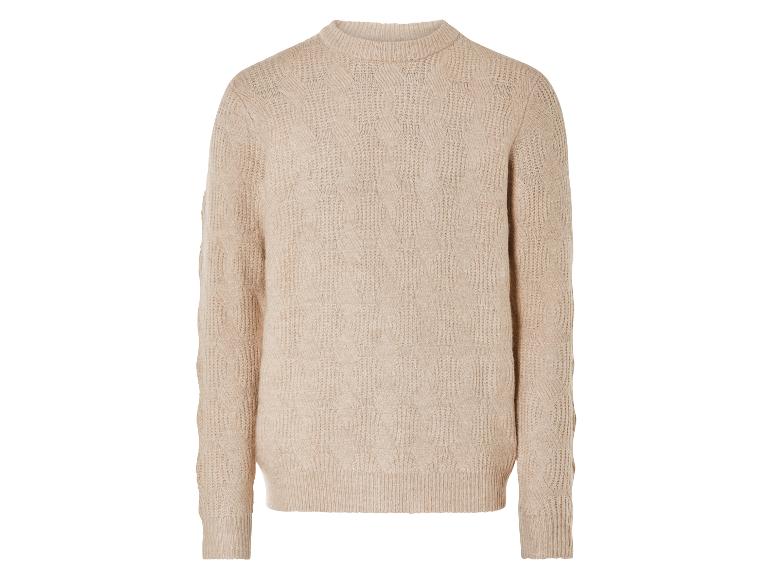 Beigefarbener Strickpullover mit Zopfmuster.