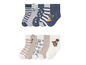 Ein Set Baby-Socken mit Tiermotiven und Streifen.