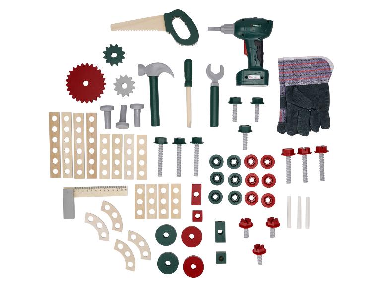 Ein Spielzeug-Baukasten mit Werkzeugen wie Bohrmaschine, Säge, Hammer und Bauteilen.