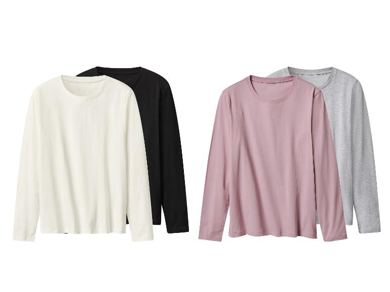 Vier Langarm-T-Shirts in Weiß, Schwarz, Rosa und Grau.