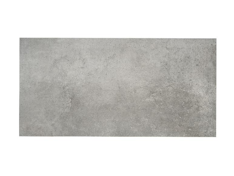 Hellgraue Betontextur mit Farb- und Kornvariationen.