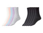 Sechs Paar Socken: vier in Pastellfarben und zwei schwarz.