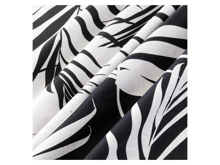 Schwarz-weißes Stoff mit einem abstrakten Blattmotiv.